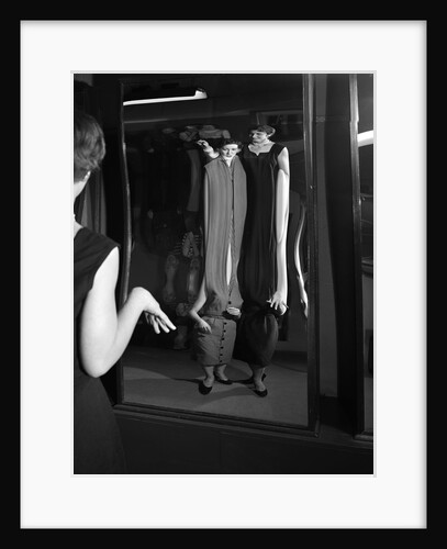 1950s Young Women Looking At Herself In Distorted Fun House Mirror by Anonymous