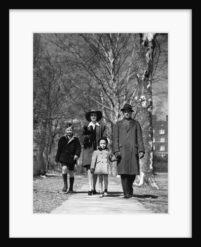 1930s 1940s Family Walking Forward Winter Suburban Sidewalk by Anonymous