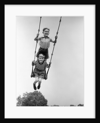 1930s Two Boys Sitting Standing On Playground Swing by Anonymous