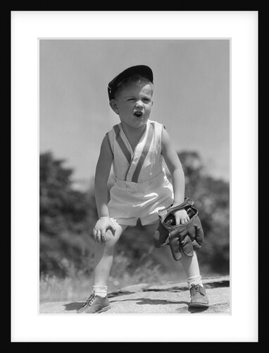 1930s Boy Wearing Baseball Hat and Glove Bent Over With Hands On Knees Yelling by Anonymous