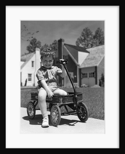 1940s Boy Sitting In Wagon by Anonymous