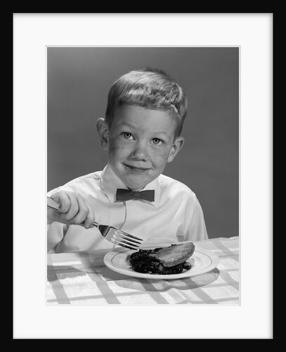 1960s Boy Wearing Bow Tie Eating Pie Dessert With Fork by Anonymous