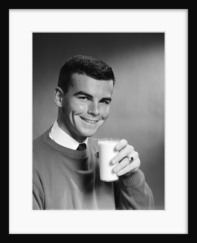 1960s Young Man Holding Glass Of Milk by Anonymous