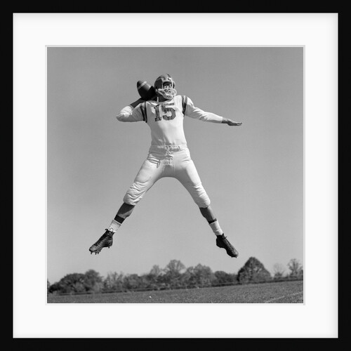 1960s Quarterback Jumping And Throwing Pass Football by Anonymous
