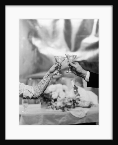 Hands and Arms Of A Bride And Groom Toasting With Champagne Glasses by Anonymous