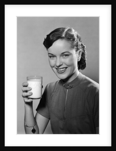 1950s Portrait Woman Holding A Glass Of Milk Studio by Anonymous