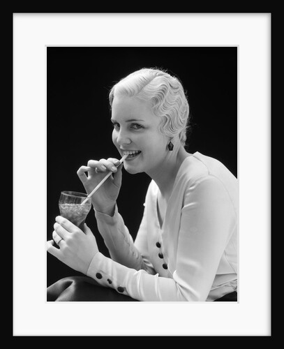 1930s Woman Drinking Soda With A Straw by Anonymous