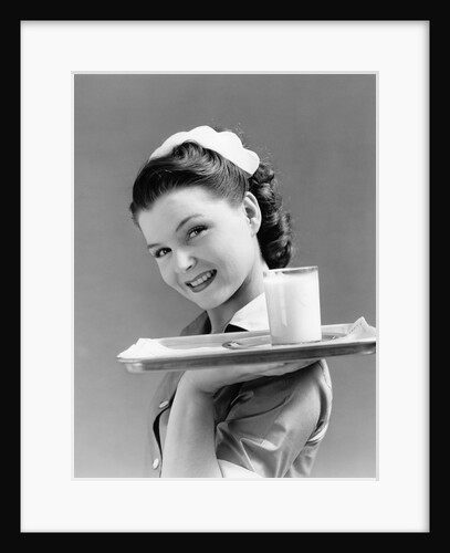 1940s Waitress Carrying Glass Of Milk On Tray by Anonymous