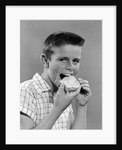 1950s Boy With Crew Cut Eating A Slice Of Bread by Anonymous
