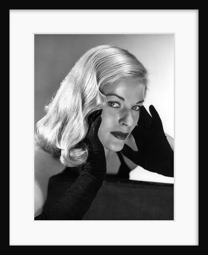 1950s Portrait Of Glamorous Woman With Long Black Gloved Hands Touching Cheek by Anonymous
