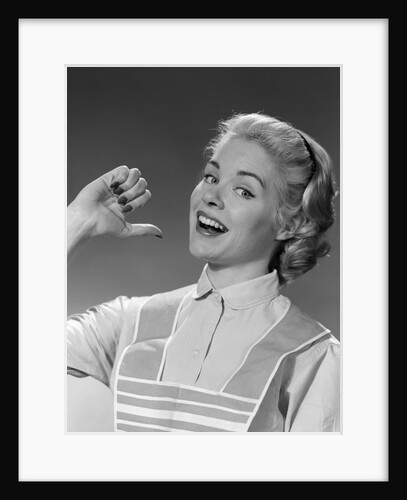 1950s 1960s Woman Housewfe In Apron Proudly Pointing At Herself With Thumb by Anonymous