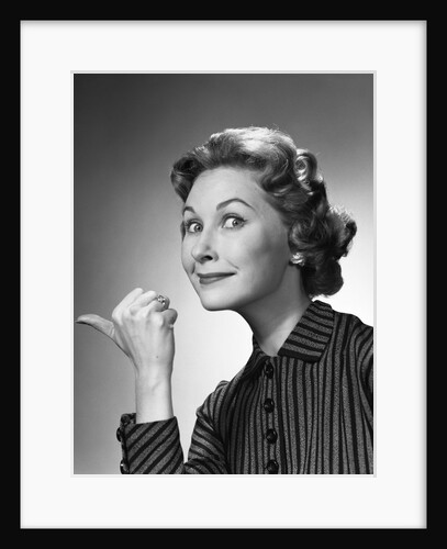 1960s Portrait Of Proud Woman Making Go Away Gesture With Thumb Studio by Anonymous