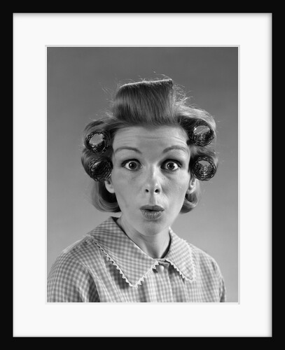 1960s Portrait Woman With Hair In Rollers Eyes Wide With Suprise by Anonymous