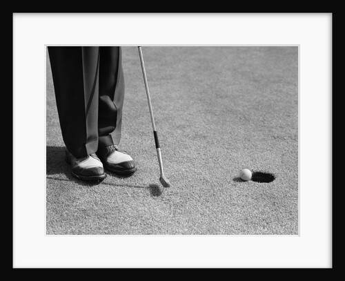 1950s Man Knees Down Putt On Golf Green by Anonymous