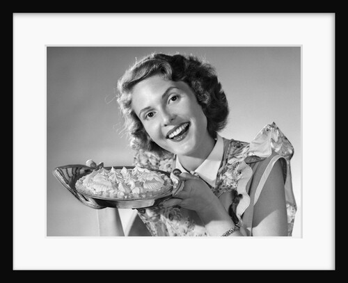 1950s Woman Presenting Holding Freshly Baked Pie by Anonymous