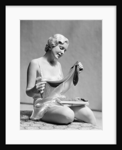 1930s Woman In Silk Teddy Lingerie Opening A Box Of Hosiery by Anonymous