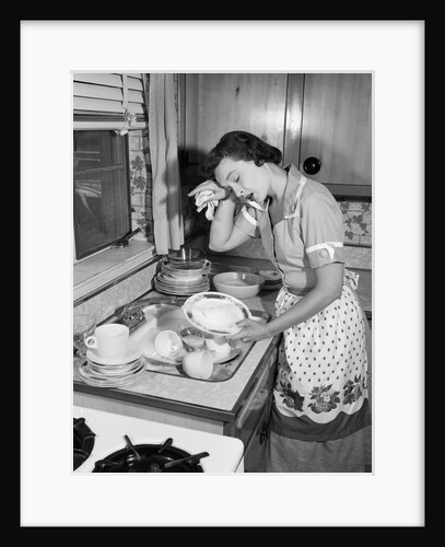 1950s Tired Exhausted Woman Housewife In Kitchen With Sink Full Of Dirty Dishes by Anonymous
