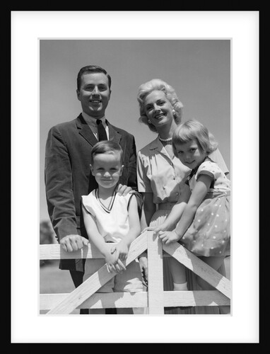 1950s 1960s Portrait Family Father Mother Son Daughter Behind White Fence Outdoor by Anonymous