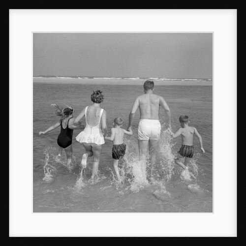 1960s Back View Of Family Of 5 Holding Hands Running Into Ocean by Anonymous