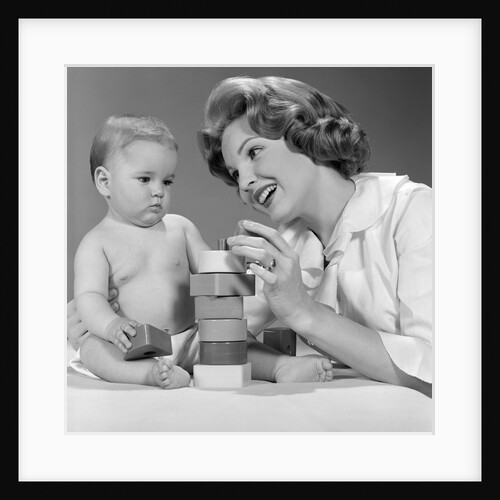 1960s Mother And Unhappy Baby Playing With Blocks by Anonymous