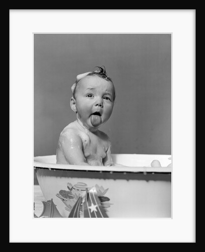1940s Wet Baby In Bath Covered With Soap Suds Sticking Out Tongue by Anonymous