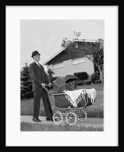1960s Man Pushing Stroller Baby Carriage Suburban Sidewalk by Anonymous