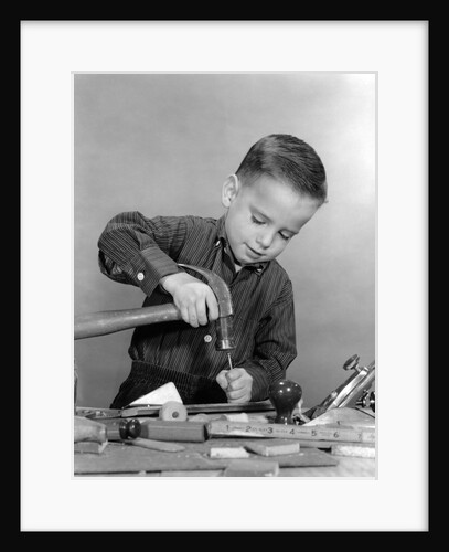 1950s Boy Playing With Hammer And Tools by Anonymous