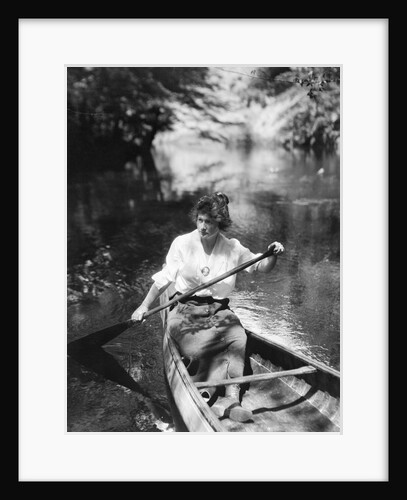 1920s Woman With Upswept Hair Paddling Wooden Canoe In Stream by Anonymous