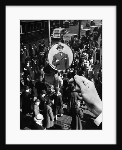 1930s 1940s Pedestrian Street Crowd Magnifying Glass Focused On Single Well Dressed Man by Anonymous