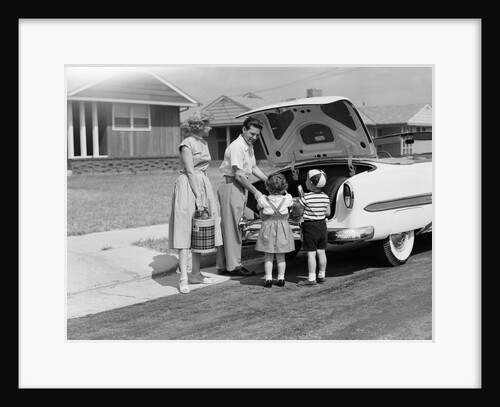 1950s Family Packing Trunk Of Car For A Picnic by Anonymous