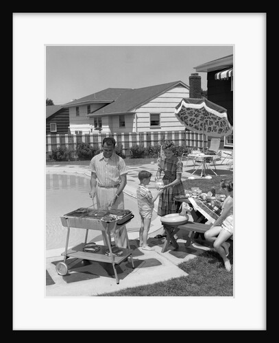 1950s Family In Backyard Beside Pool Having Cookout Of Hot Dogs and Hamburgers by Anonymous