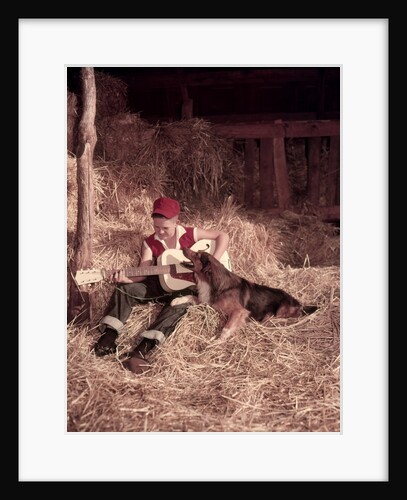 1950s Boy Playing Guitar Collie Dog Sitting Hay Bales Inside Barn by Anonymous