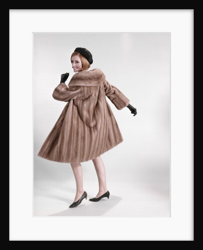 1960s Woman Wearing Fur Mink Coat Black Hat Shoes Gloves Turning To Look Over Shoulder by Anonymous