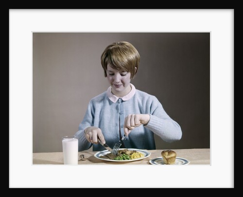1960s Teenage Girl Eating Wholesome Dinner by Anonymous