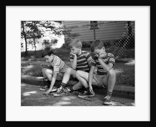 1970s Three Bored Boys Sitting On Curb All Wearing Striped Tee Shirts Shorts And Sneakers by Anonymous