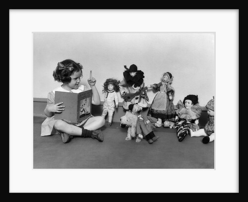 1930s Girl Pointng A Finger Reading To A Row Of Dolls Toys Stuffed Animals by Anonymous