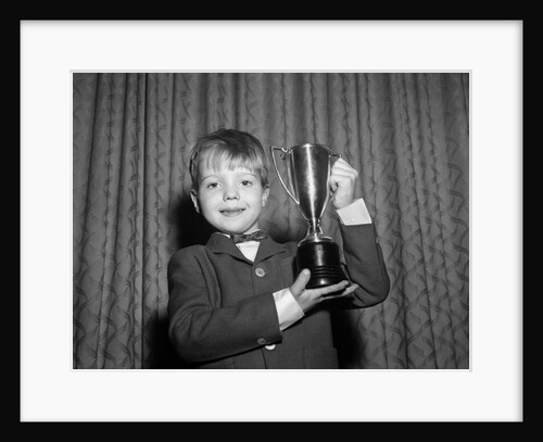1950s Proud Boy Holding Up Trophy Award by Anonymous