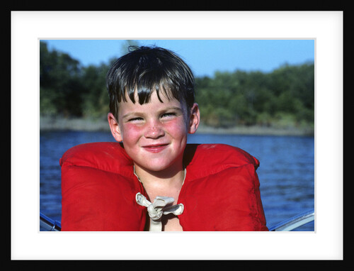 Young Boy Wearing Red Life Preserver by Anonymous