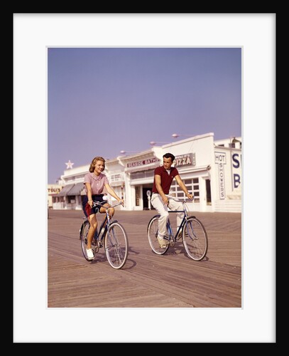 1950s Teen Couple Riding Bikes On The Boardwalk Jersey Shore by Anonymous