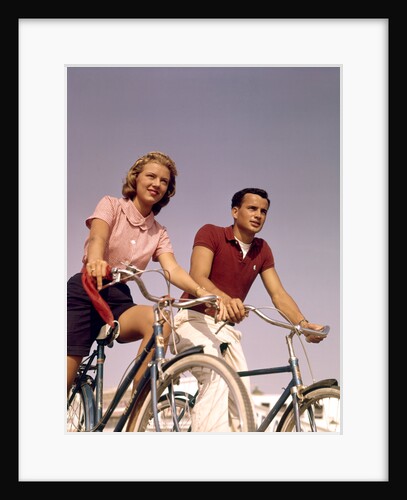 1950s 1960s Couple Man Woman Riding Bicycles Outdoors by Anonymous