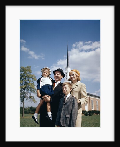 1960s Portrait Family Standing Together In Front Of Church Outdoor by Anonymous