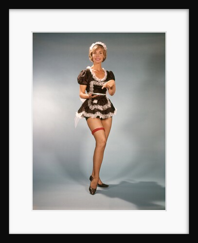 1960s Woman Wearing Short Black and White Lace French Maid Costume Pointing To Silver Tray by Anonymous