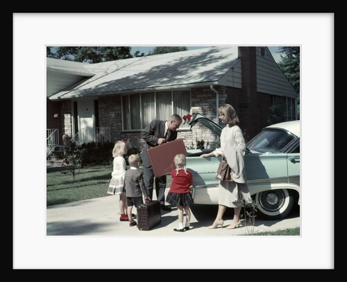 1950s 1960s Suburban Family Loading Ford Four Door Sedan Automobile For Trip by Anonymous