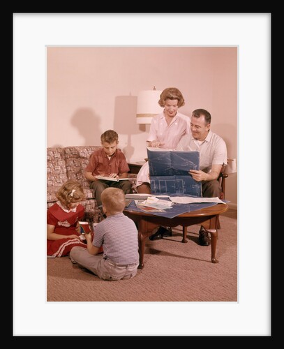 1960s Family In Living Room Looking At New House Blueprint Plans by Anonymous