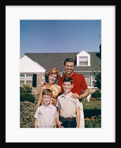 1960s Portrait Family Father Mother Two Sons Standing Together In Front Of Suburban House by Anonymous