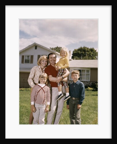 1960s Family In Front Of A Suburban Split Level House by Anonymous
