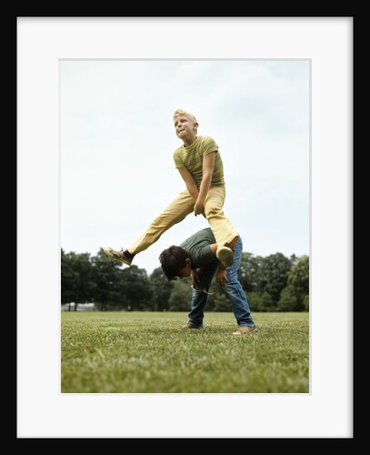 1970s Two Boys Jumping Playing Leapfrog by Anonymous