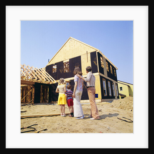 1970s Family In Front Of A House Under Construction by Anonymous