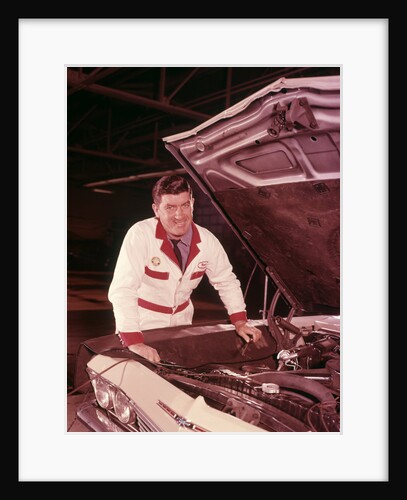 1960s Mechanic In White Overalls Working On Car Engine In Gas Service Station Repair Shop by Anonymous