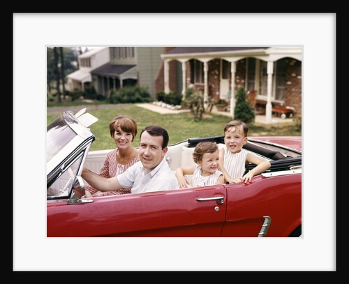 1960s Suburban Family Sitting In Red Ford Convertible Mustang by Anonymous